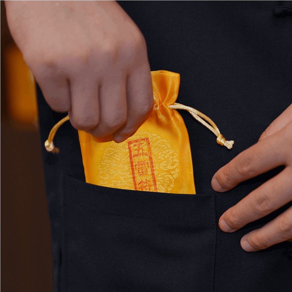 Five Thunder Talisman pouch fitting in pocket, practical usage demonstration