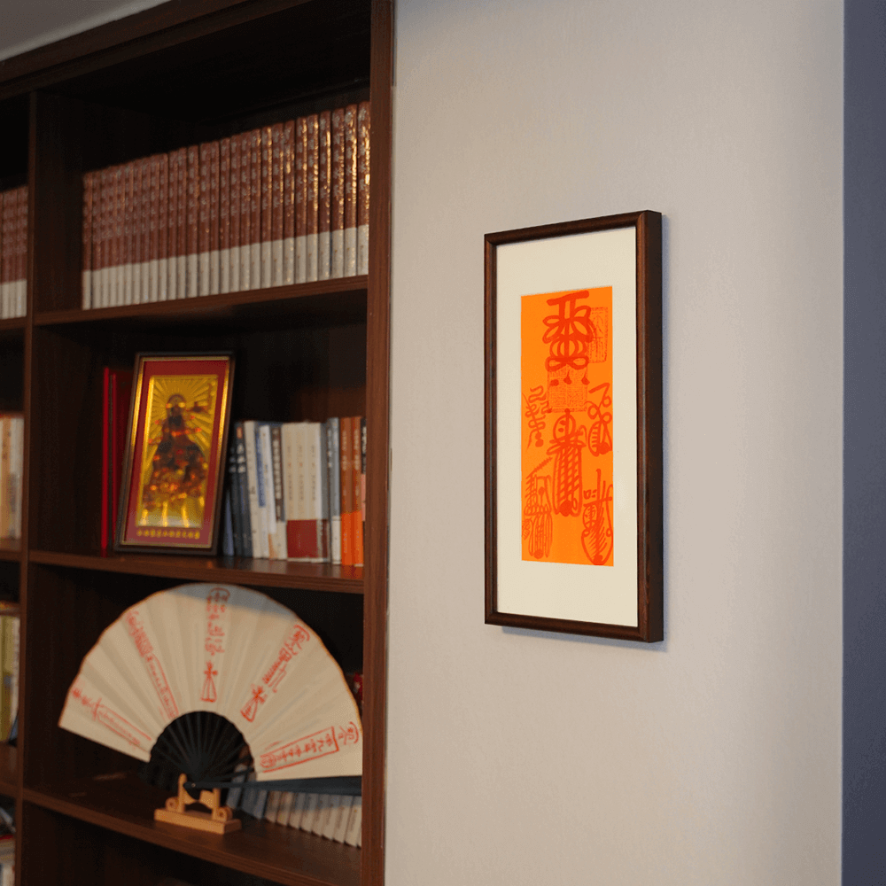 Five Thunder Talisman hung above bookshelf with yin-yang symbols and esoteric Taoist ritual objects.