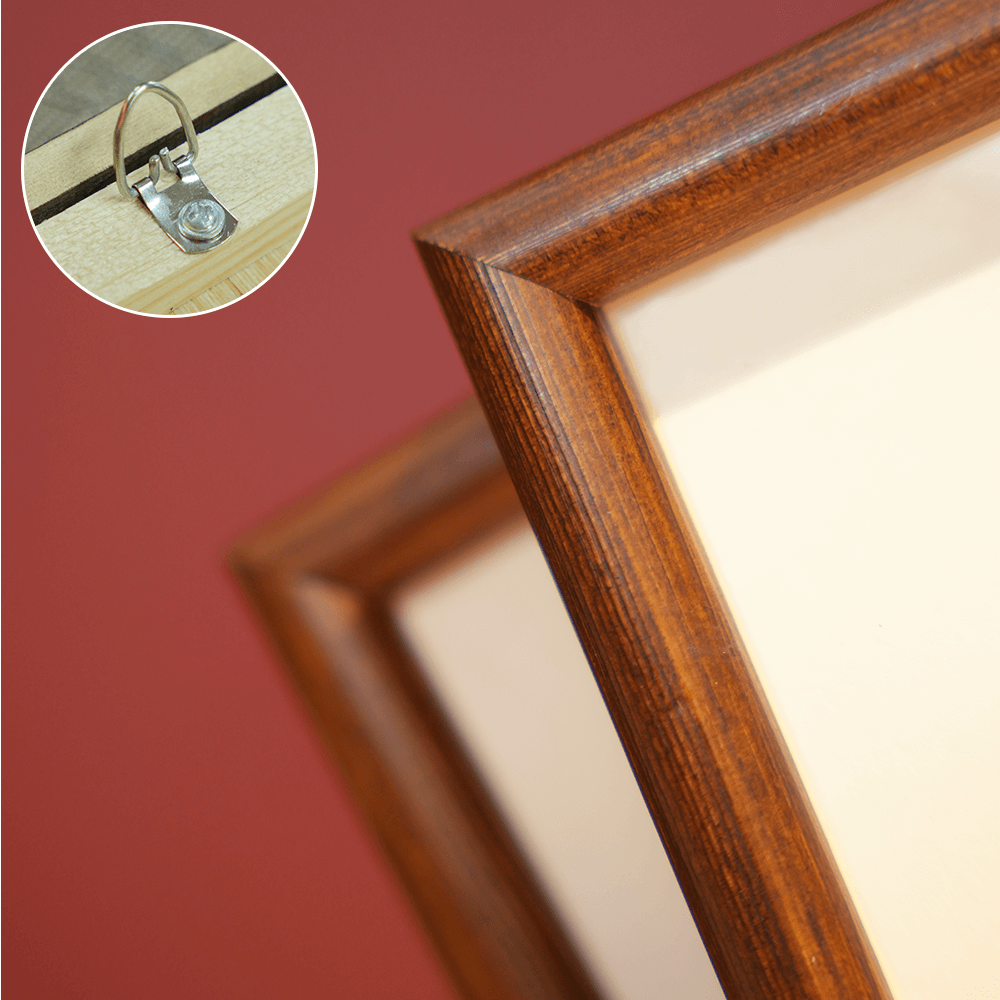 Close-up detail of carved wooden frame corner and embroidered Safety Talisman texture.