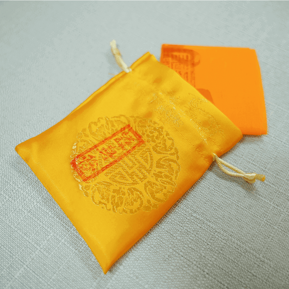 Layered protection talisman cloth with pouch, compact stacking side view