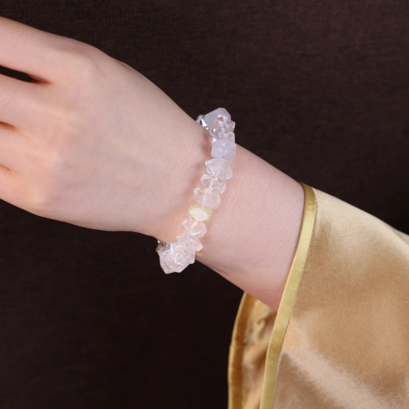 Close up of a 5 element crystal bracelet worn on the wrist.