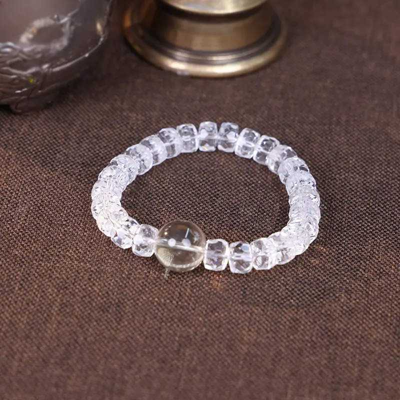 White phantom quartz bracelet styled with vintage brass props.
