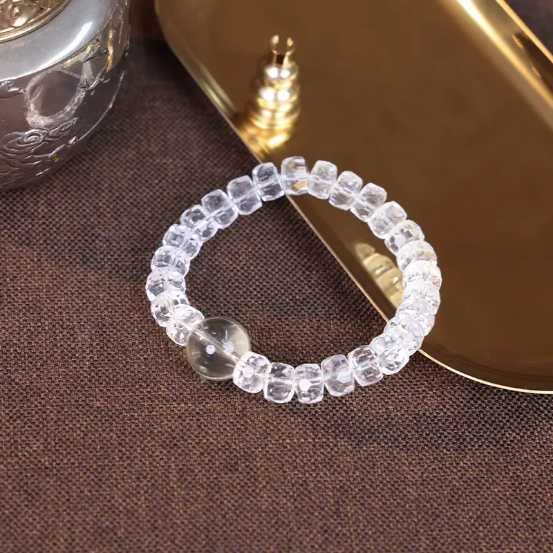 Citrine bead bracelet displayed on a golden tray for success.