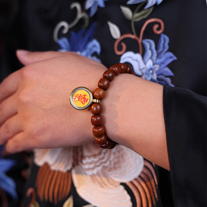 Man wearing a wood element bracelet for wood energy and protection.