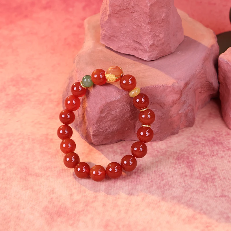 Natural red agate bracelet representing vitality and fire element.