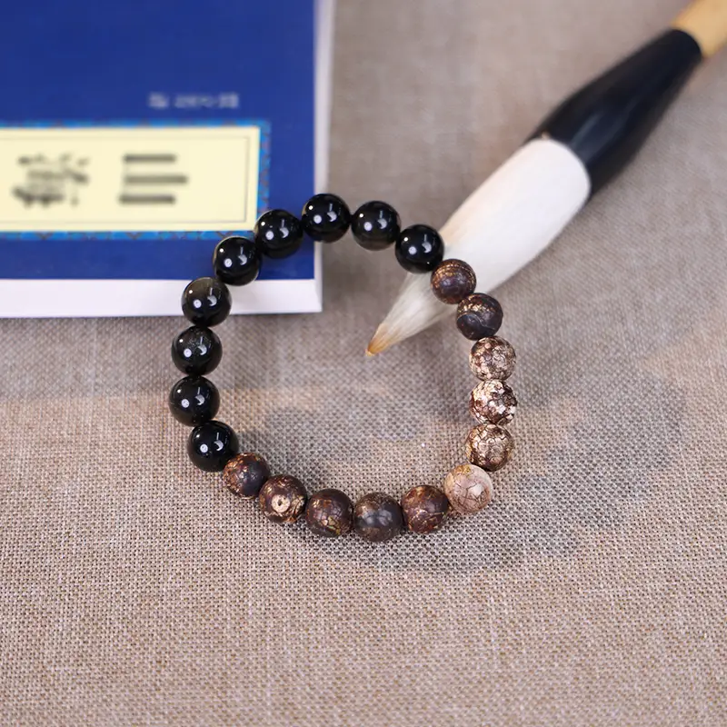 Tiger eye bead bracelet for wisdom styled with the I Ching classic.