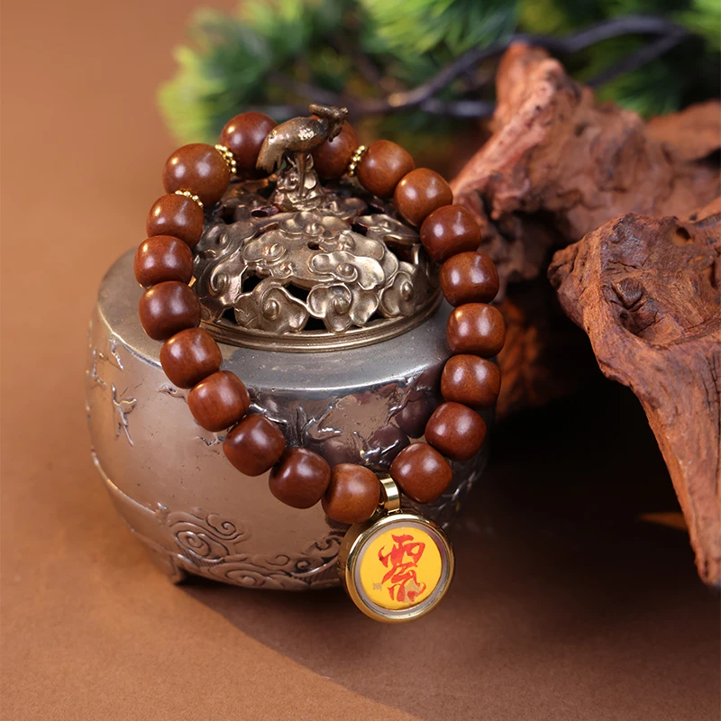Wood element bracelet styled with vintage brass props.