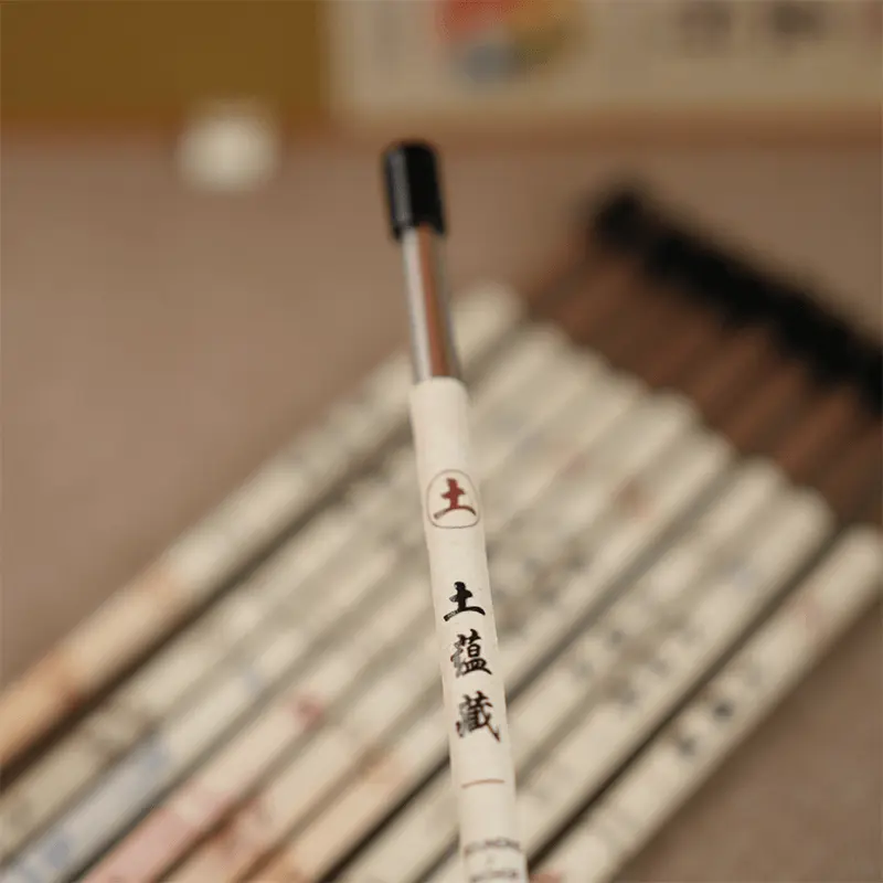 Close-up of a single incense tube.